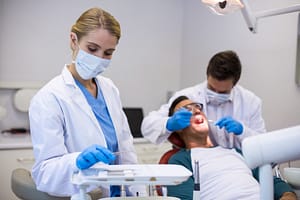 Dentist taking care of a patient