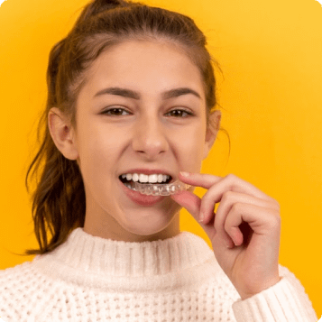 yellow background girl with braces