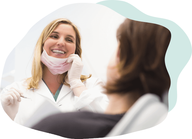woman dentist smiling to client