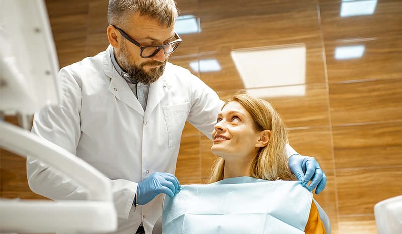 dental pro with patient